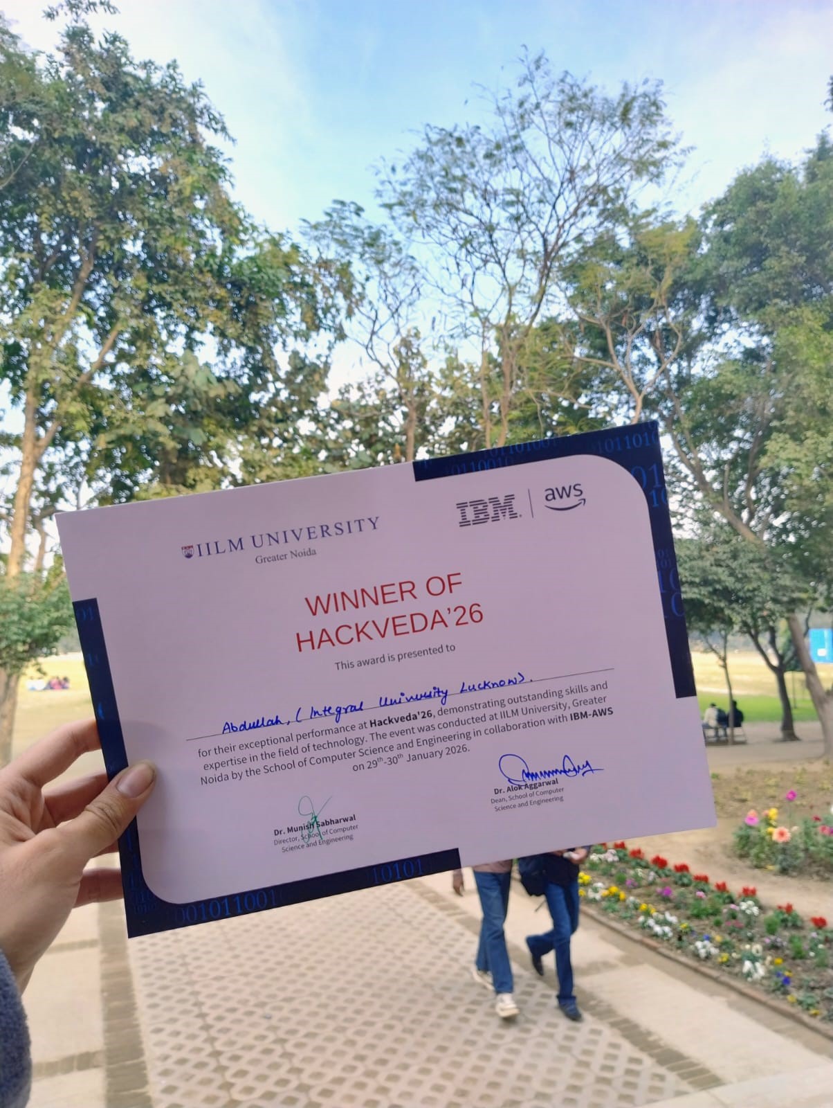 HackVeda winner certificate held outdoors